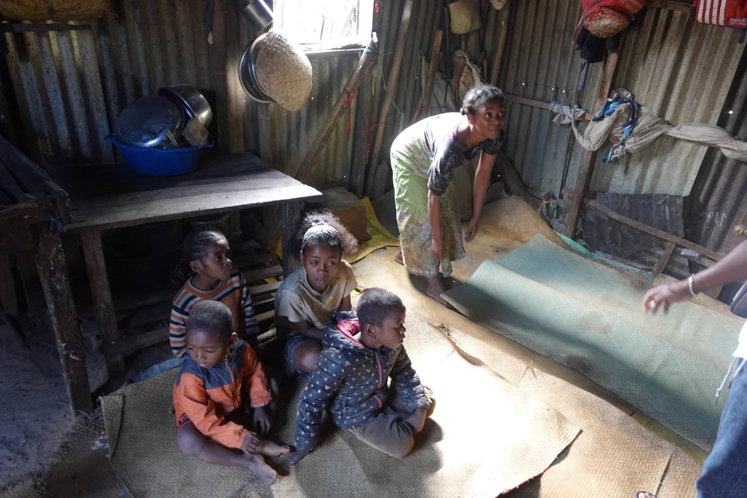 children with the mother in a family house