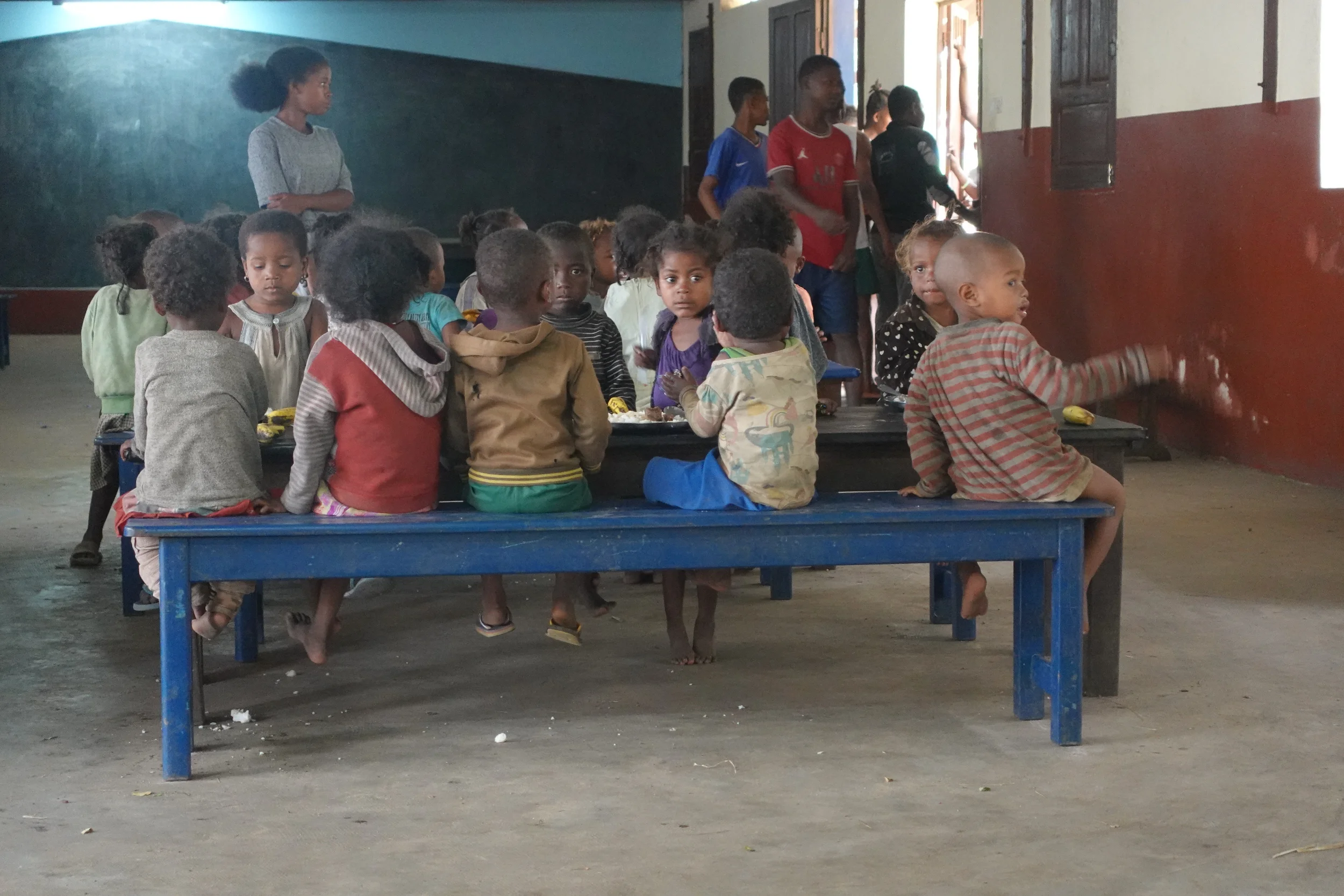 Plates of rice and bananas laid out for children at a school in Fort Dauphin